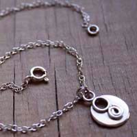 Lina, chaîne de cheville et bracelet spirale en argent