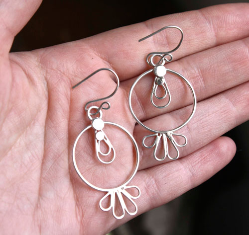 Soleil toltèque, boucles d’oreilles préhispaniques en argent